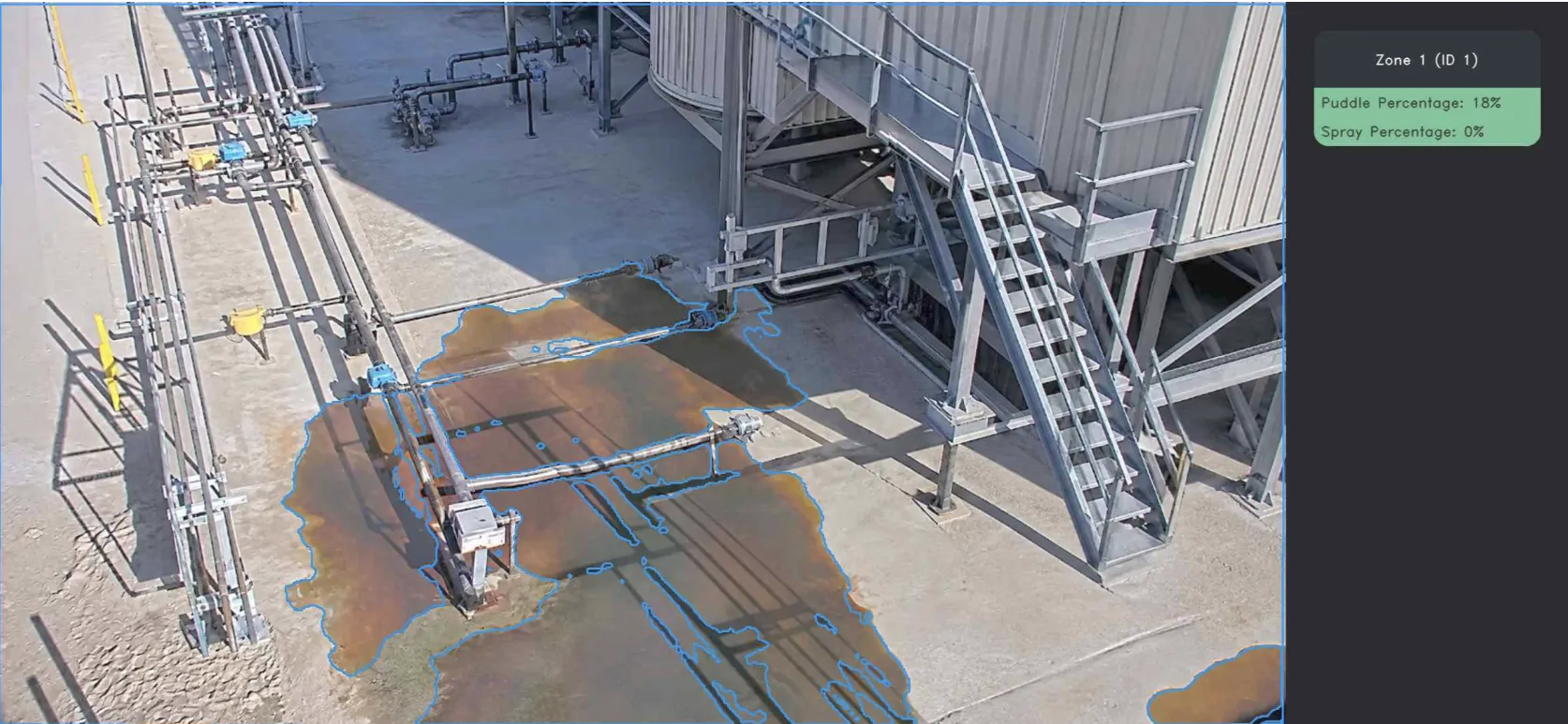 VisionAery Liquid Leak Detection — visible puddle outlined at base of tank battery stairs