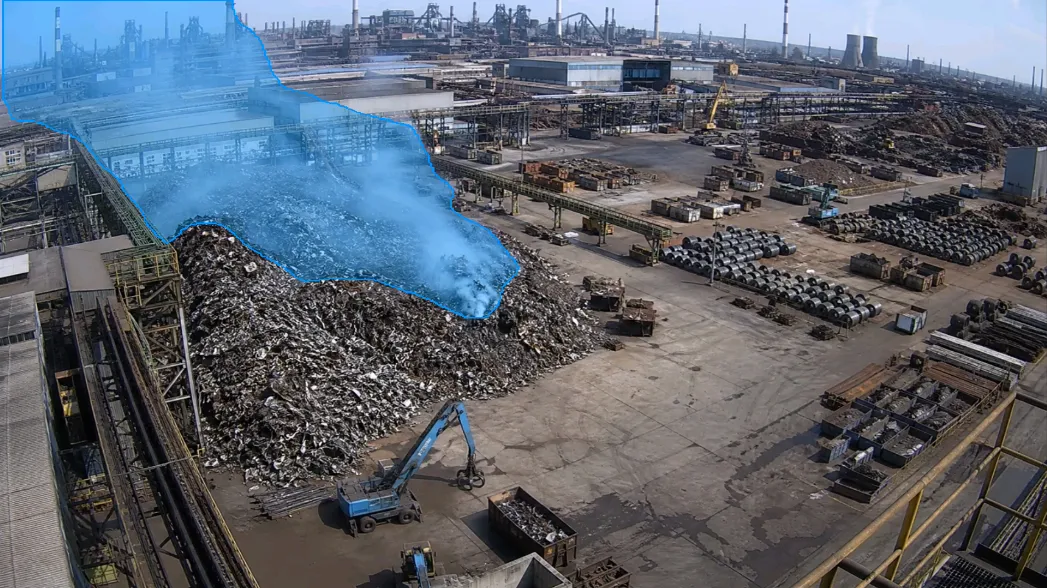 Scrap metal yard — aerial smoke plume outline