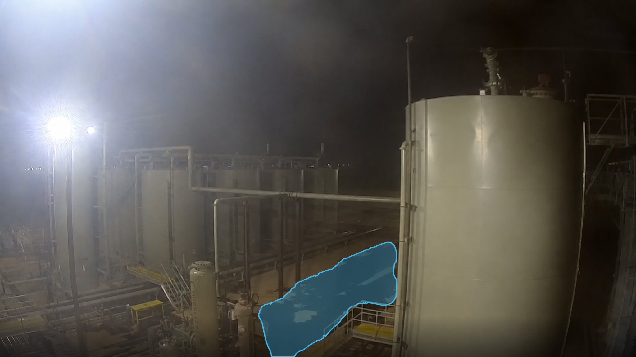 Production Facility Leak at Night — puddle detection overlay