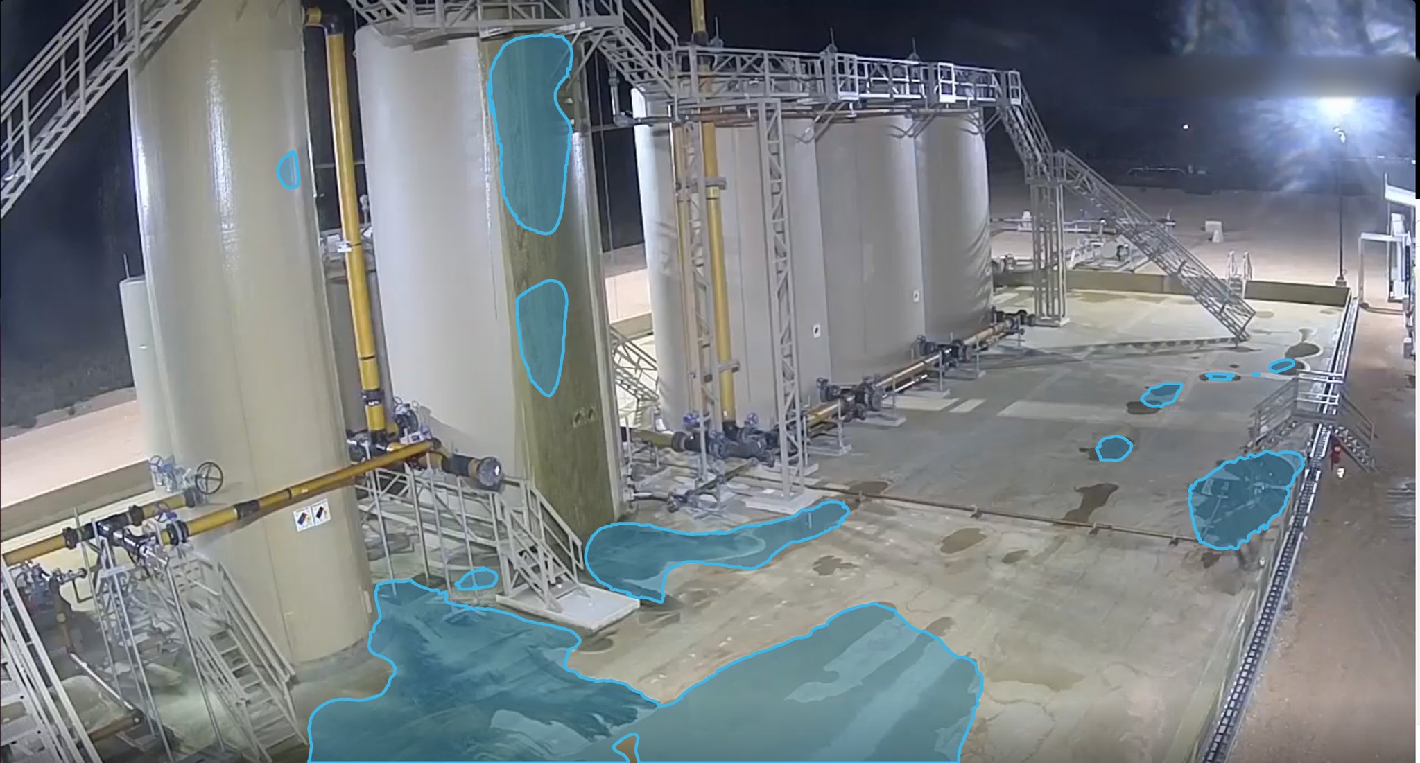 Production Facility Leak at Night — puddle detection overlay