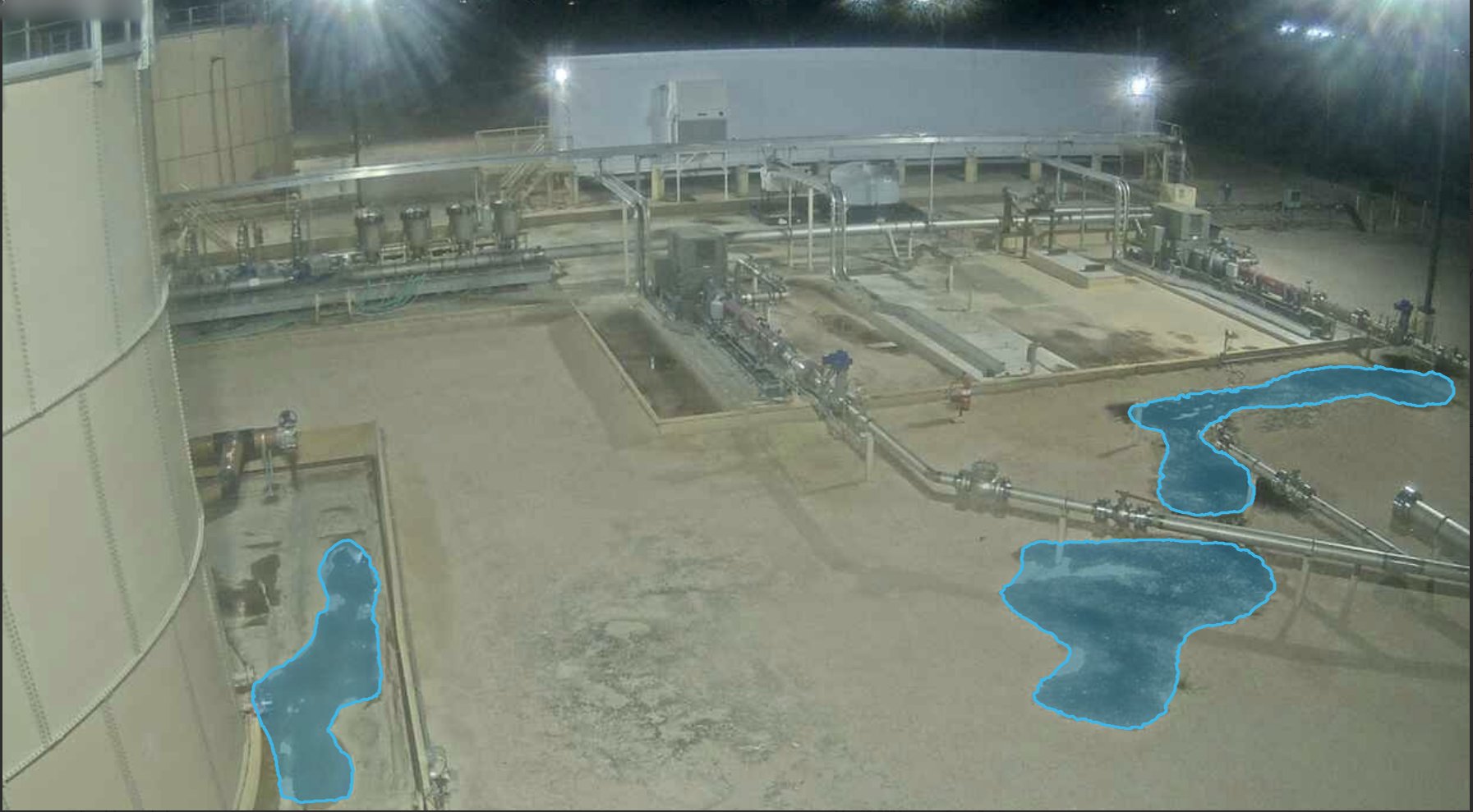 Production Facility Leak at Night — puddle detection overlay