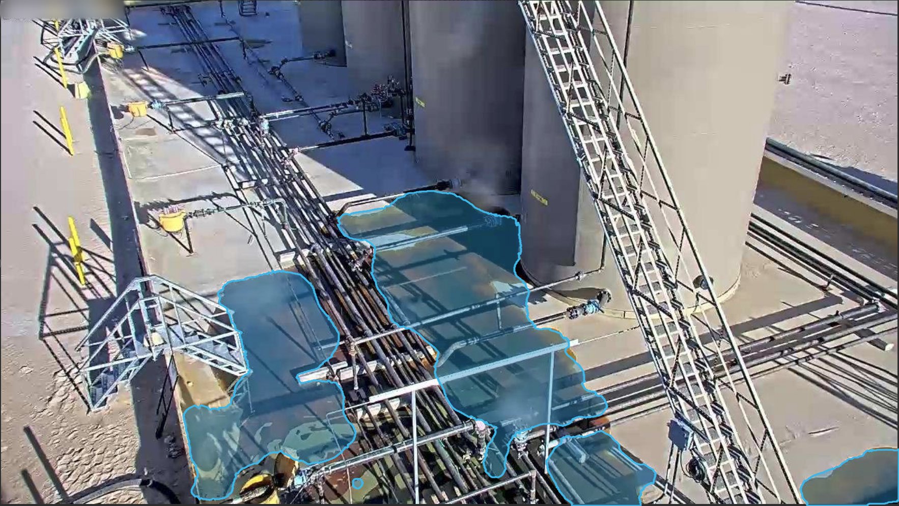 Pipe rack and storage tanks, puddle detected