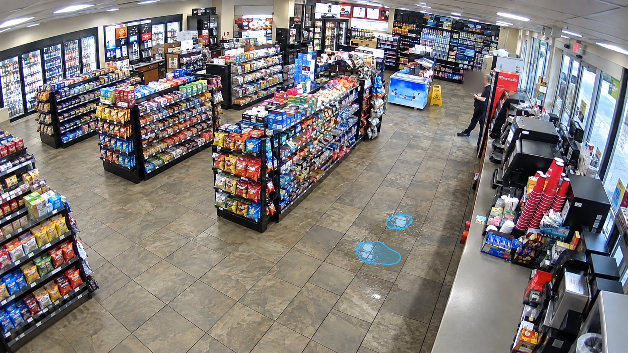 Convenience Store Aisle Spill — puddle detection overlay