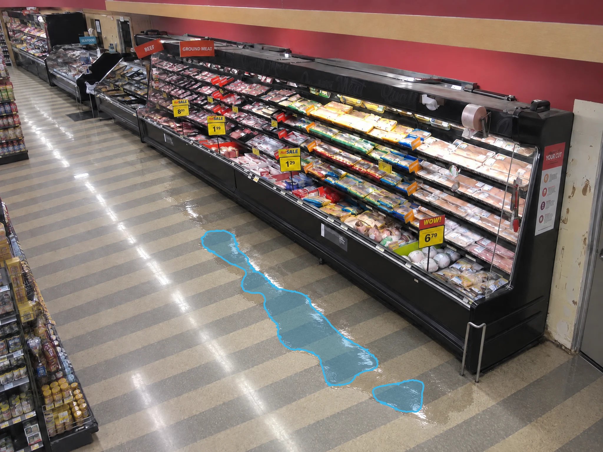 Retail grocery store, puddle detected